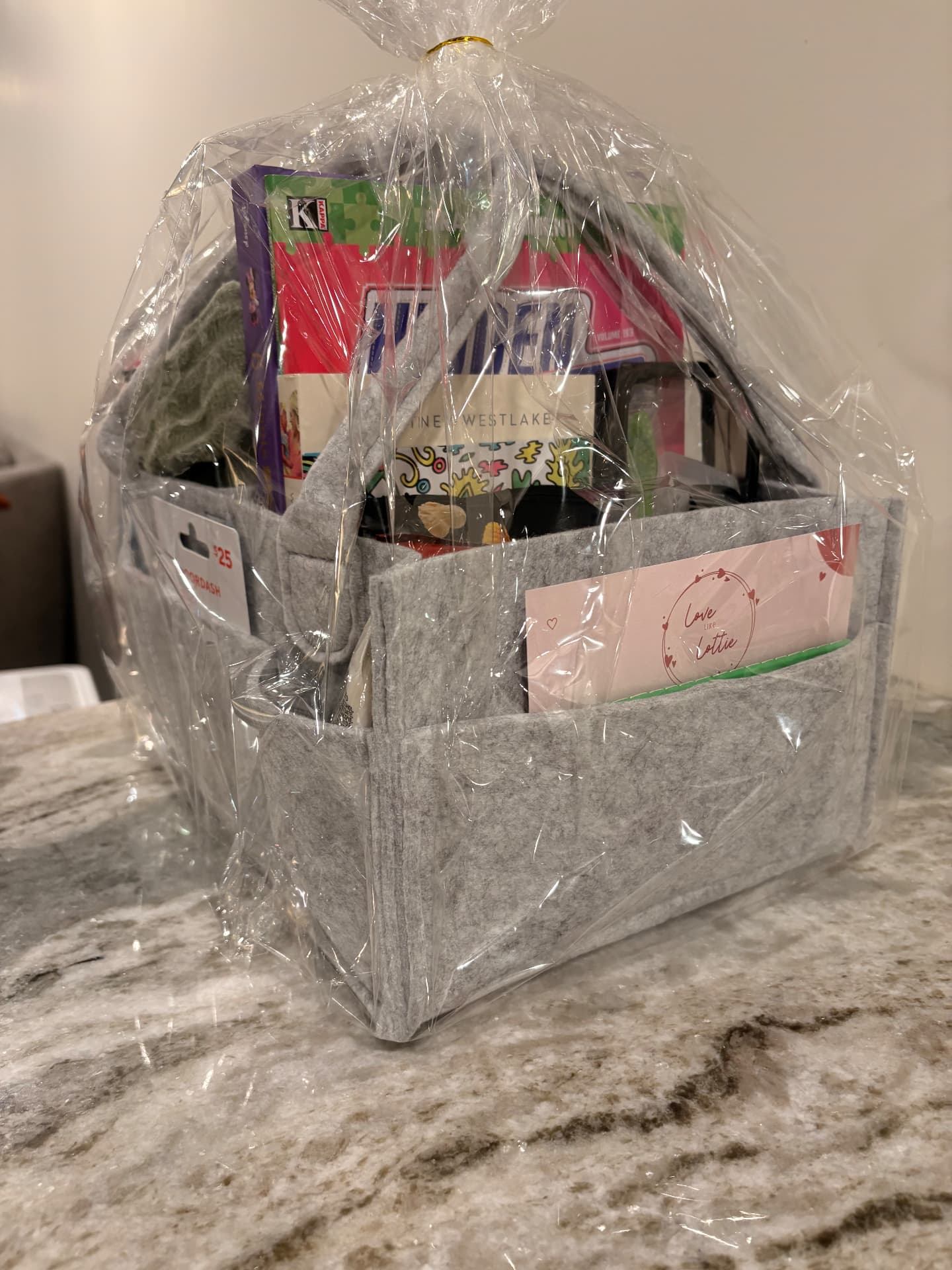 A wrapped Love Like Lottie care package filled with essentials